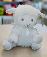 musical white Lullaby Lamb that plays Jesus loves me and has a little silver embroidered cross on the foot