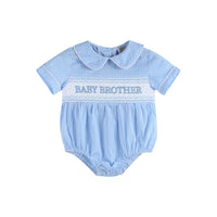 blue and white checked baby boy romper with embroidered baby brother stitched across the front